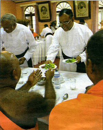 Priests serving food to Buddhist monks
